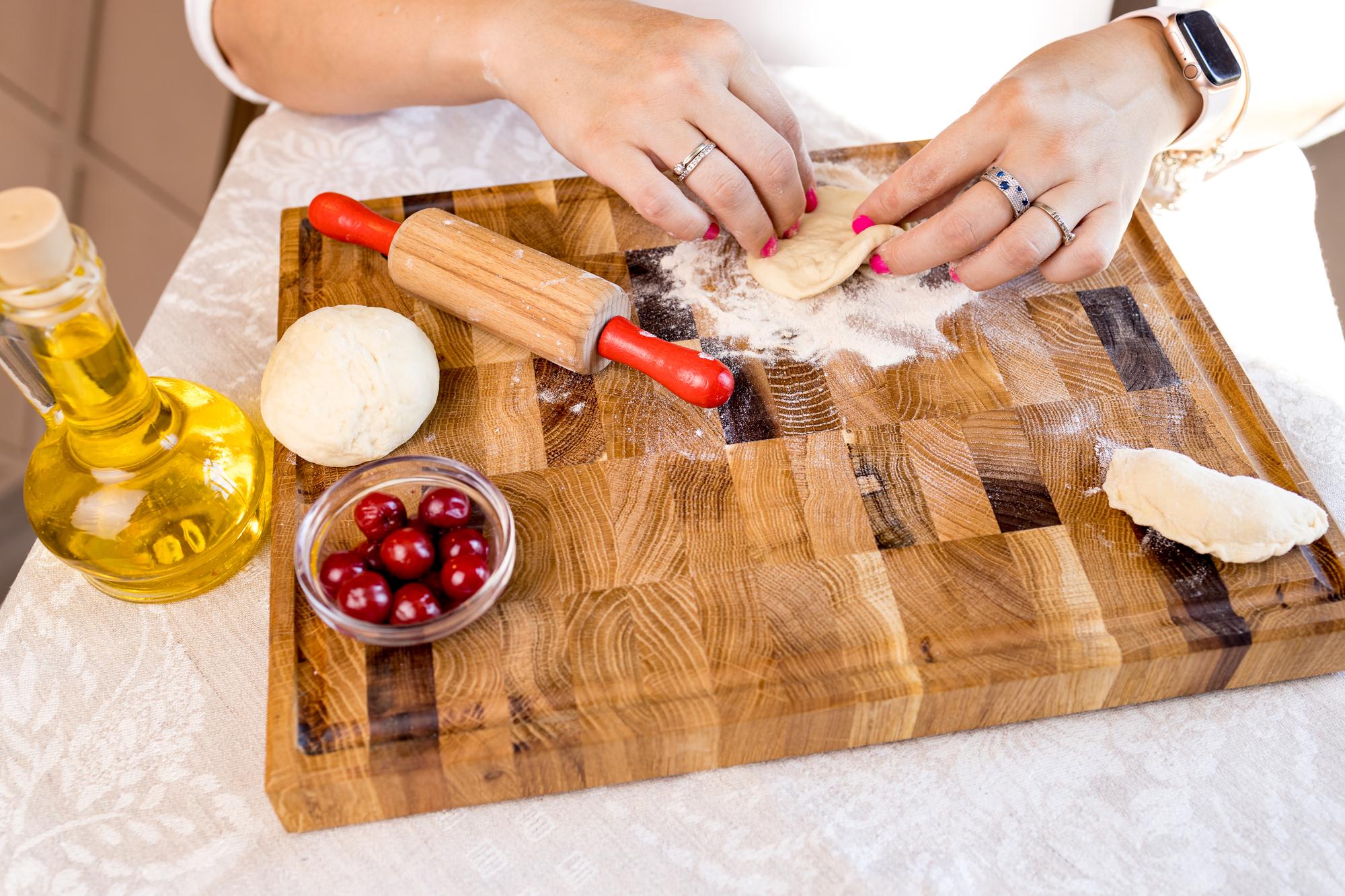 Workshop teacher preparing ingredients on a wooden table