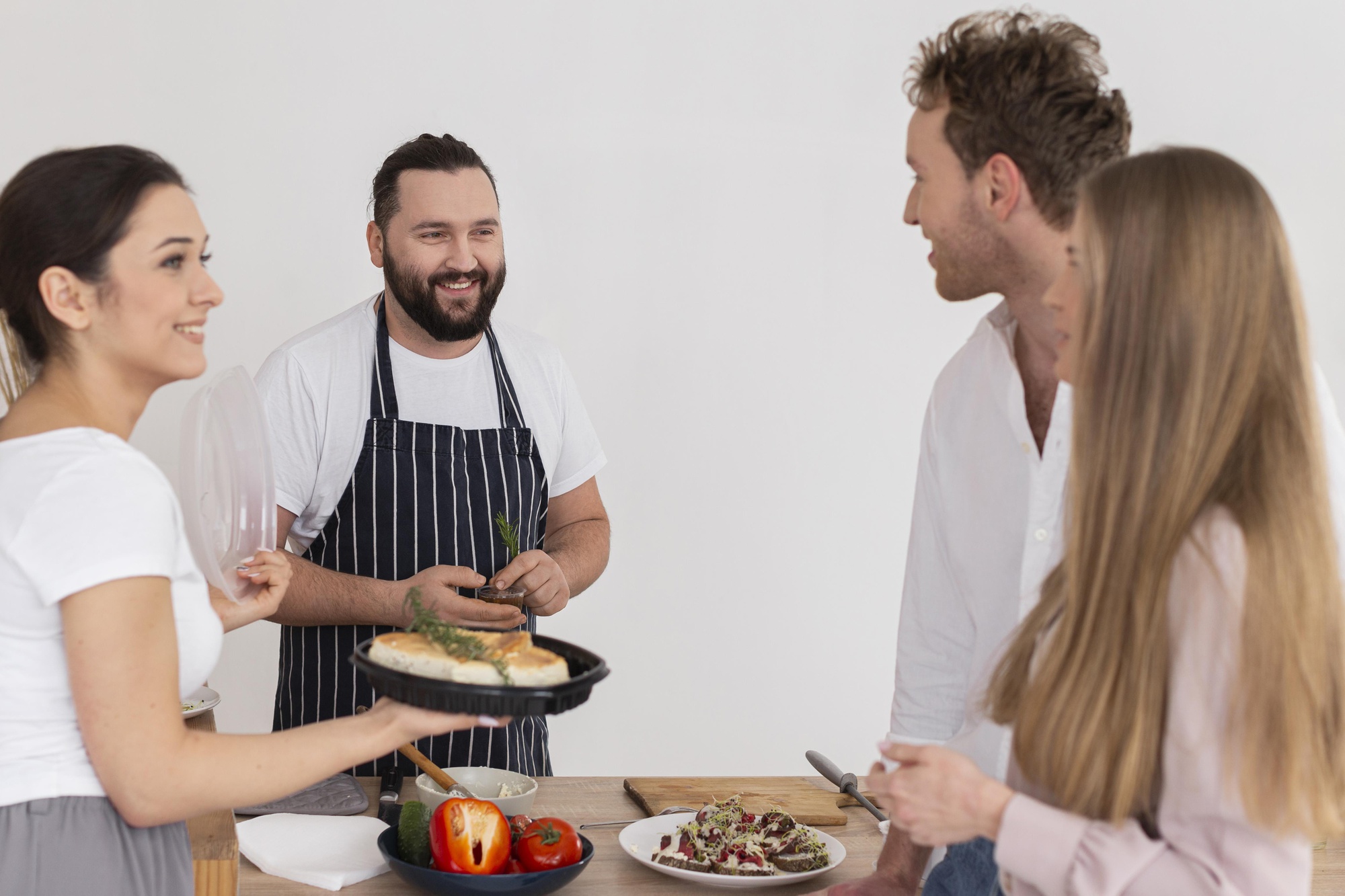 Instructor speaking with participants in kitchen studio